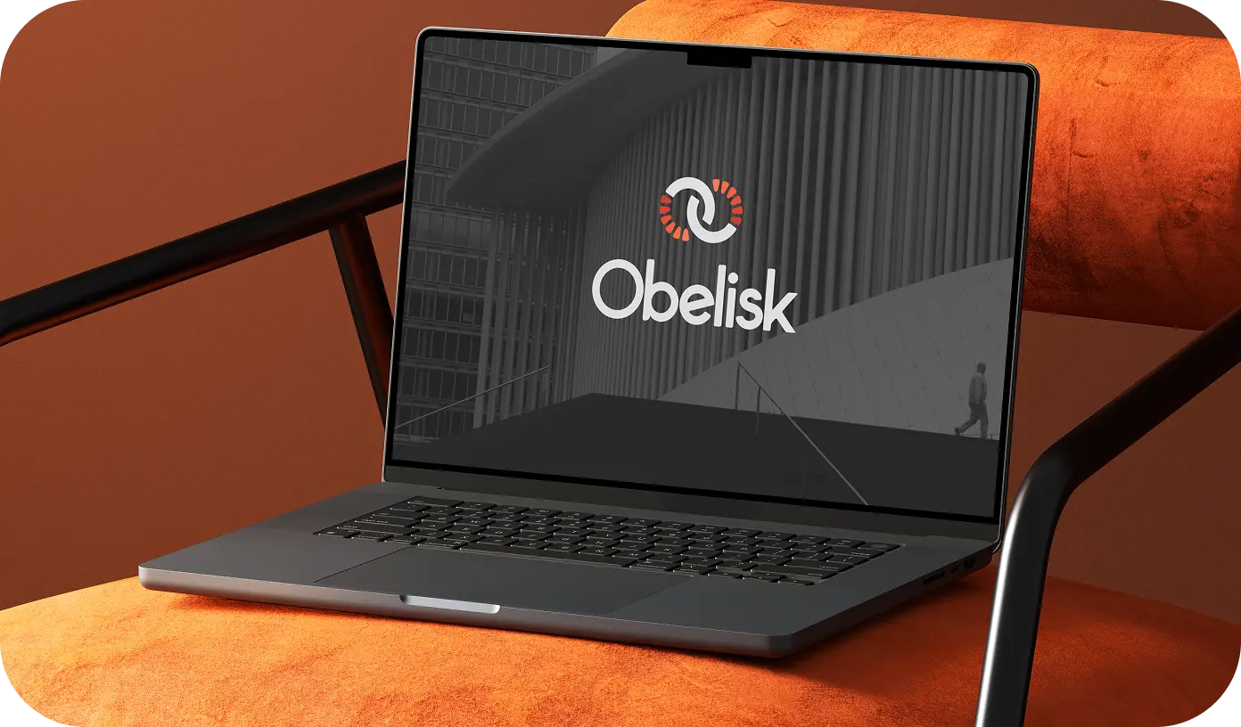 Obelisk brand identity — logo system shown on a laptop screen